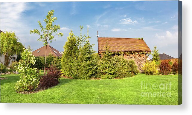 Garden Acrylic Print featuring the photograph Backyard of a family house. Landscaped garden with green mown grass, wood shelter. by Michal Bednarek