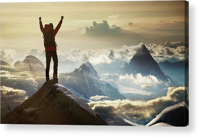Scenics Acrylic Print featuring the photograph Climber Standing On A Mountain Summit by Buena Vista Images