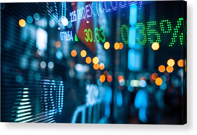 Financial Figures Acrylic Print featuring the photograph Display of Stock market quotes with city scene reflect on glass by Nikada