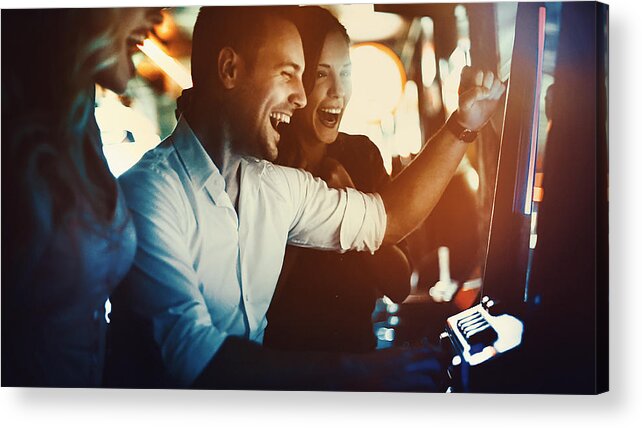 People Acrylic Print featuring the photograph Group of people having fun in casino. by Gilaxia