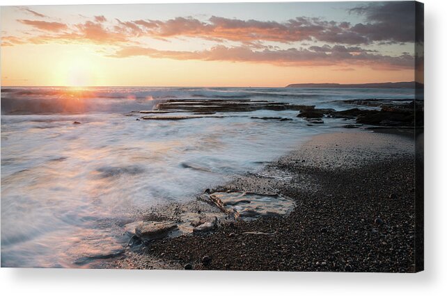 Seascape Acrylic Print featuring the photograph Beautiful dramatic Sunset over a rocky coast by Michalakis Ppalis