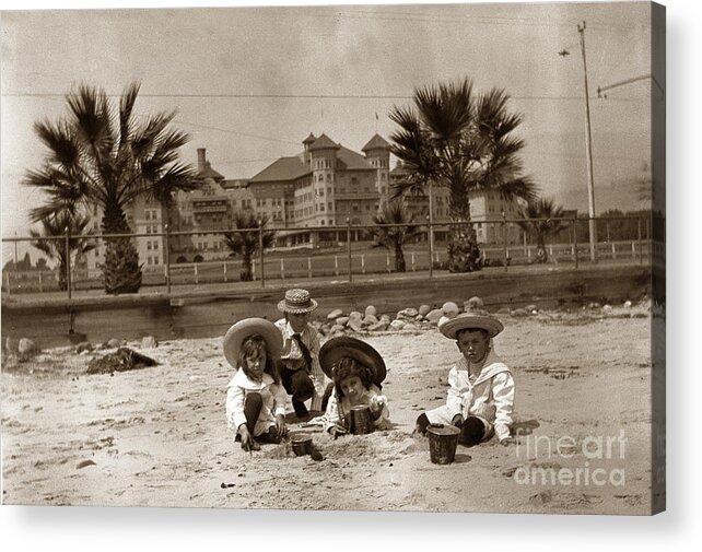 Children Acrylic Print featuring the photograph Children on the Santa Barbara beach in front of the Potter Hotel circa 1915 by Monterey County Historical Society