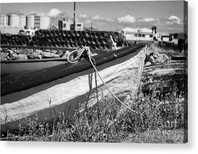 Galway Acrylic Print featuring the photograph old white traditional boat tied up on grass shoreline on corrib river near harbour Galway by Joe Fox