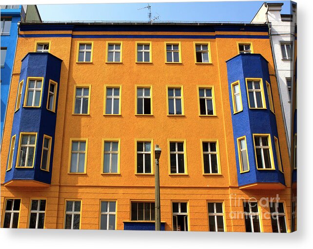 Orange And Blue In East Berlin Acrylic Print featuring the photograph Orange and Blue in East Berlin by John Rizzuto