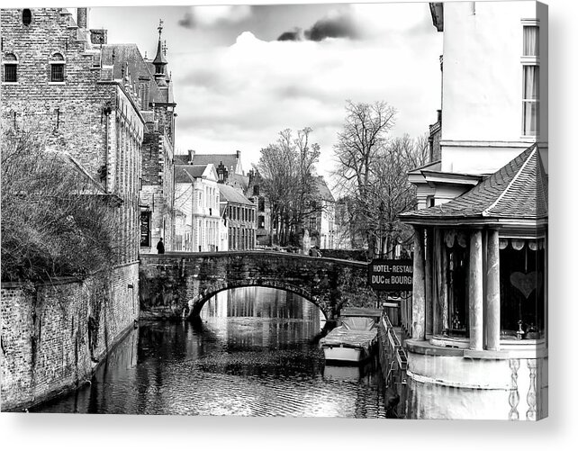 On The Canal Bridge In Bruges Acrylic Print featuring the photograph On the Canal Bridge in Bruges by John Rizzuto