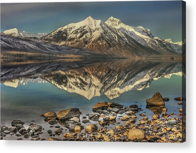 Reflections Of The Towering Mountains At Glacier National Park Acrylic Print featuring the photograph Reflecting Beauty by Carolyn Hall
