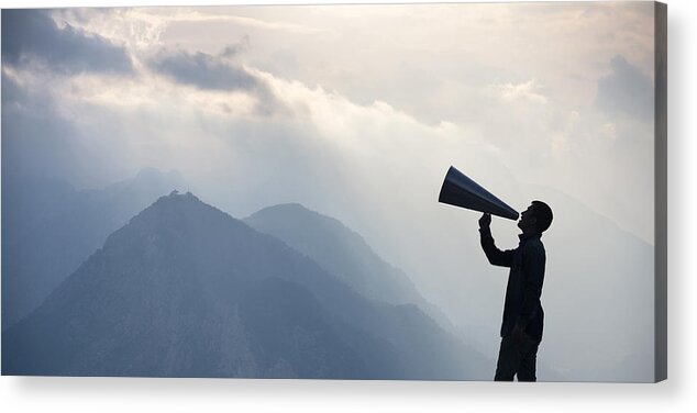 Tranquility Acrylic Print featuring the photograph Young man shouting into megaphone by Ozgur Donmaz