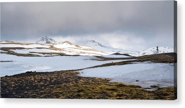 Iceland Acrylic Print featuring the photograph Icelandic landscape with mountains and meadow land covered in snow. Iceland by Michalakis Ppalis