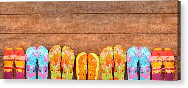 Beach Acrylic Print featuring the photograph Brightly colored flip-flops on wood by Sandra Cunningham