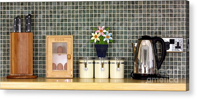 Block Acrylic Print featuring the photograph Clean kitchen worktop with kitchen items by Simon Bratt