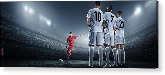 Soccer Uniform Acrylic Print featuring the photograph Soccer Player Kicking Ball In Stadium #5 by Dmytro Aksonov