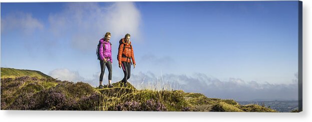 Scenics Acrylic Print featuring the photograph Young woman and teenage hiker walking picturesque summer mountain panorama by fotoVoyager