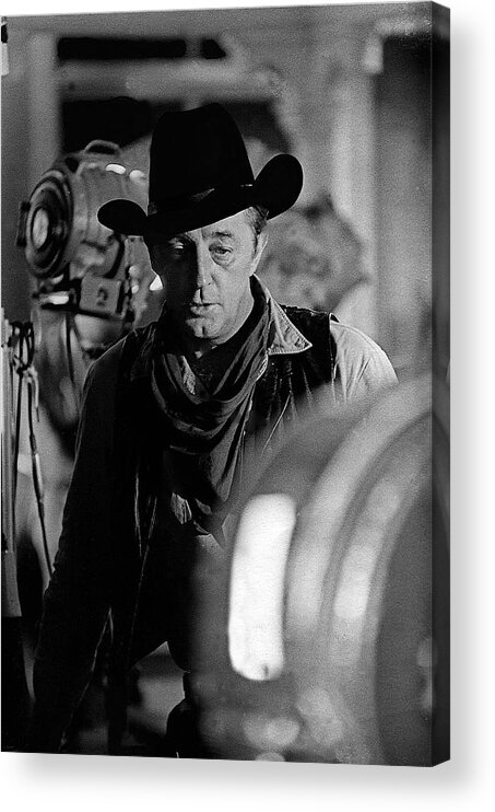 Robert Mitchum Lights Young Billy Young Set Old Tucson Sound Stage Black And White Acrylic Print featuring the photograph Robert Mitchum lights Young Billy Young set Old Tucson by David Lee Guss
