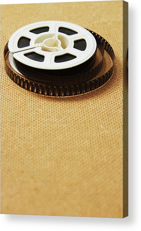 The Media Acrylic Print featuring the photograph A Reel, Or Spool, Of 8mm Movie Film #2 by Jon Schulte