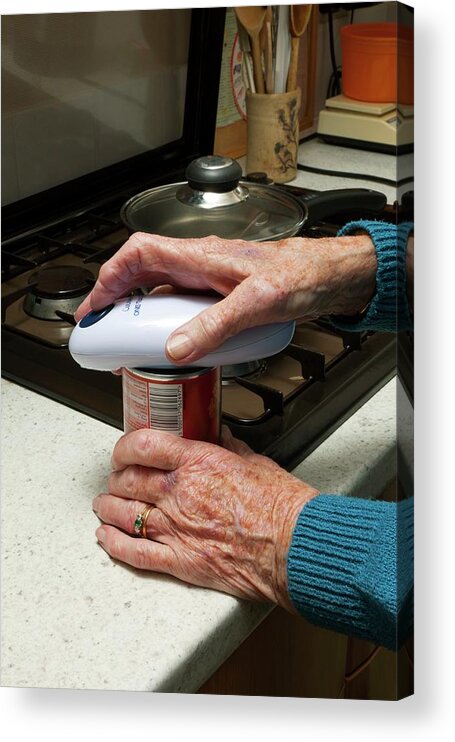 Human Acrylic Print featuring the photograph Elderly Woman Opening A Tin #2 by Paul Rapson/science Photo Library