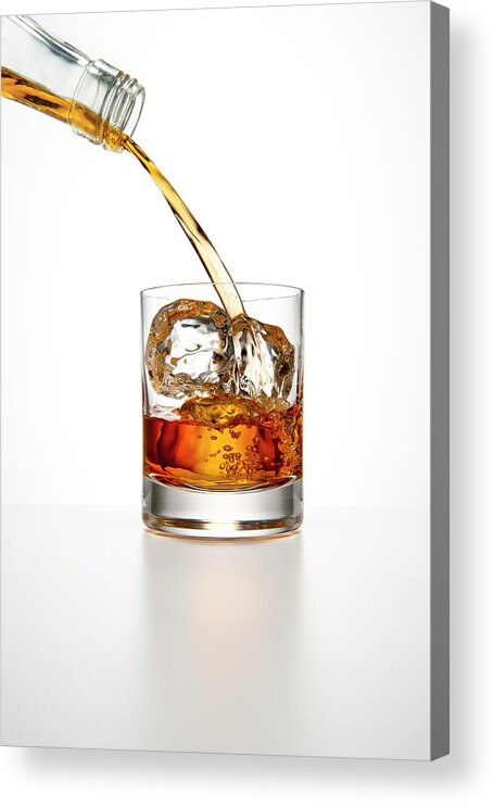 White Background Acrylic Print featuring the photograph Brown Liquor Pouring Into A Glass Of Ice by Chris Stein