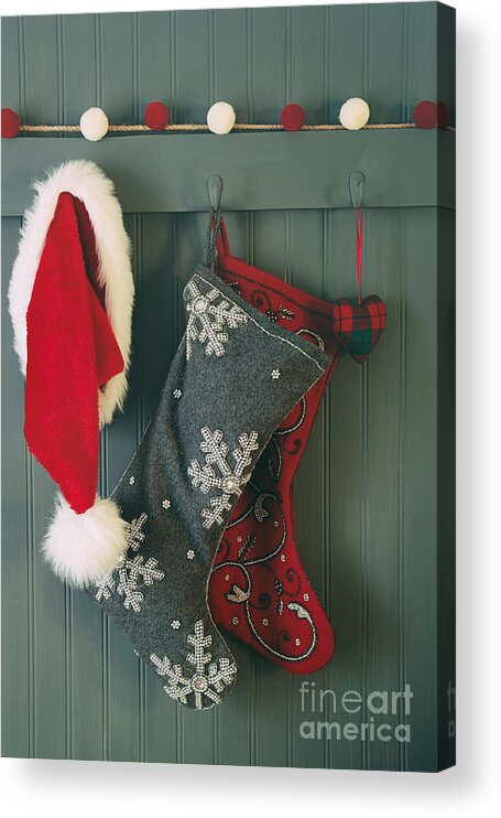 Christmas Acrylic Print featuring the photograph Hanging stockings and Santa hat on hook by Sandra Cunningham