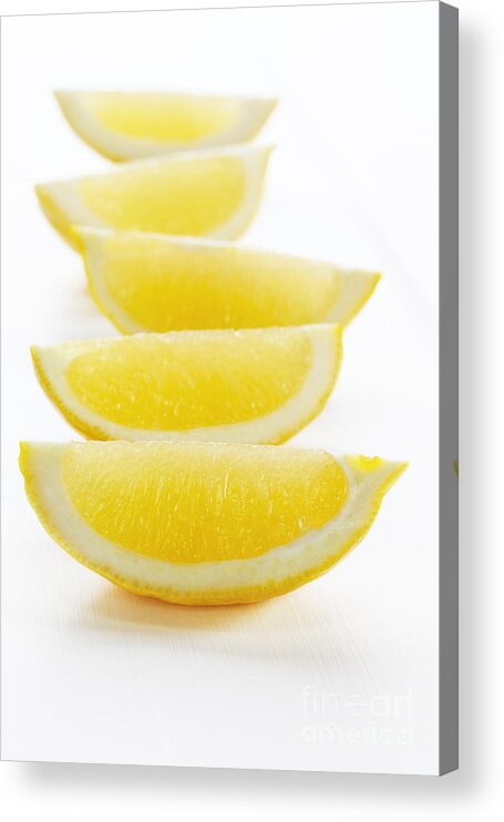 Lemon Acrylic Print featuring the photograph Lemon Wedges on White Background by Colin and Linda McKie