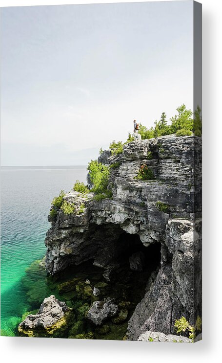 Clear Sky Acrylic Print featuring the photograph Man Hiking With Dog On Coastline by The Open Road Images