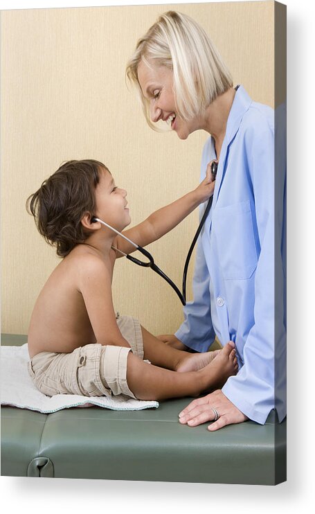 Expertise Acrylic Print featuring the photograph Young boy plays with doctor's stethoscope. by Katrina Wittkamp