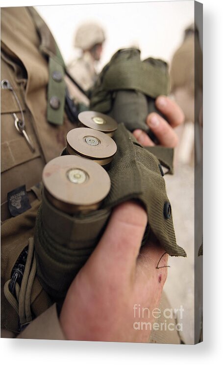 40mm Acrylic Print featuring the photograph A Marine Cradles Handfuls Of 40 Mm by Stocktrek Images