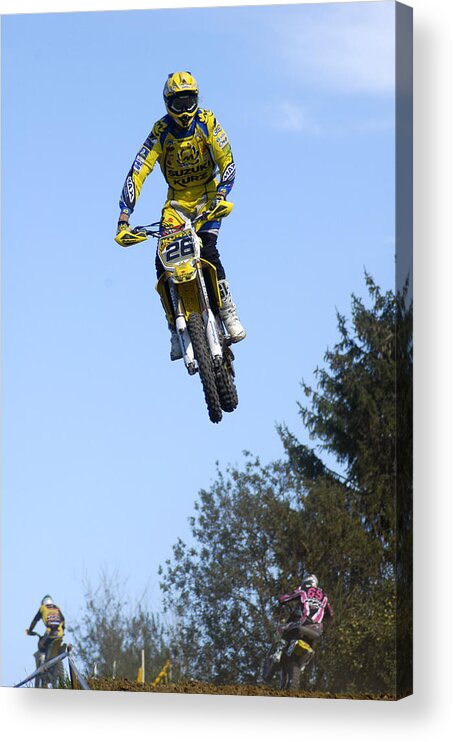 Motocross Acrylic Print featuring the photograph Motocross Rider jumping high by Matthias Hauser