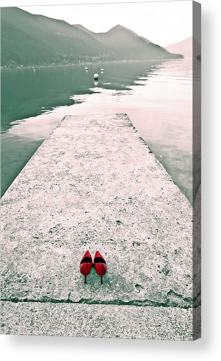 Shoes Acrylic Print featuring the photograph A Pair Of Red Women's Shoes Lying On A Walkway That Leads Into A by Joana Kruse