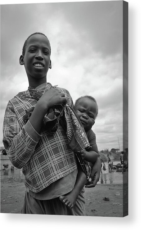 Boy Acrylic Print featuring the photograph Boy with a baby by Iao Martins