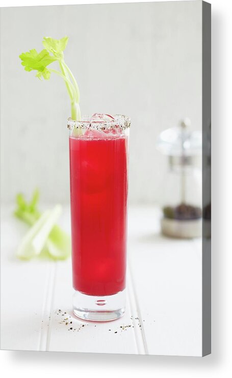 Ip_11364699 Acrylic Print featuring the photograph A Bloody Mary In A Longdrink Glass With A Peppered Rim And A Celery Stick by Charlotte Tolhurst