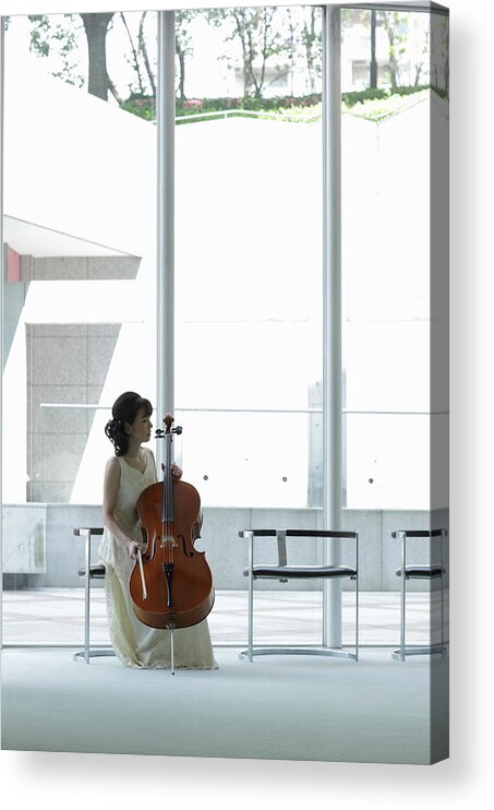 Three Quarter Length Acrylic Print featuring the photograph A Female Cellist Making Herself At Home by Sot