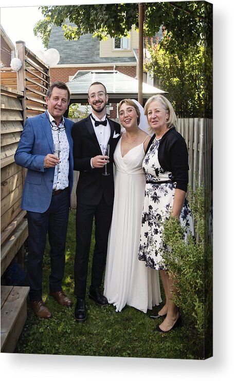 Outdoors Acrylic Print featuring the photograph Millennial newlywed couple posing with grandparents in backyard. #2 by Martinedoucet