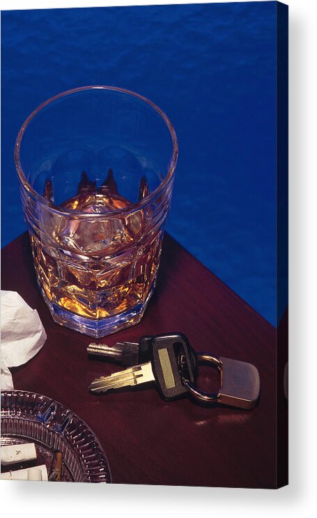Punishment Acrylic Print featuring the photograph Alcoholic beverage next to car keys symbolizes drunk driving by Comstock