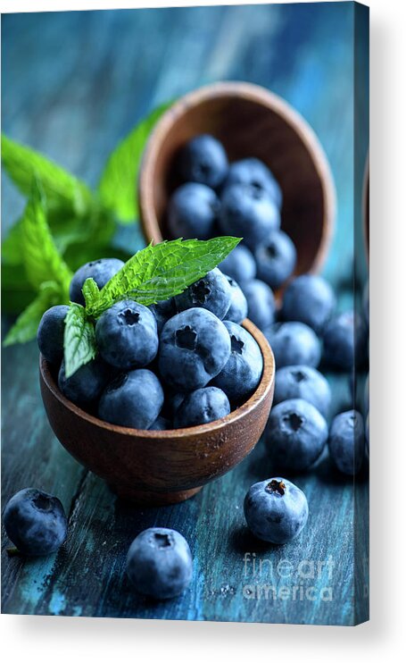 Blueberries Acrylic Print featuring the photograph Blueberries in wooden bowl with mint leaf by Jelena Jovanovic