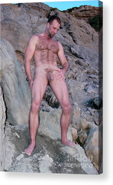 Nude Acrylic Print featuring the photograph Handsome and sexy hairy man stands in front of a rocky hillside. by Gunther Allen