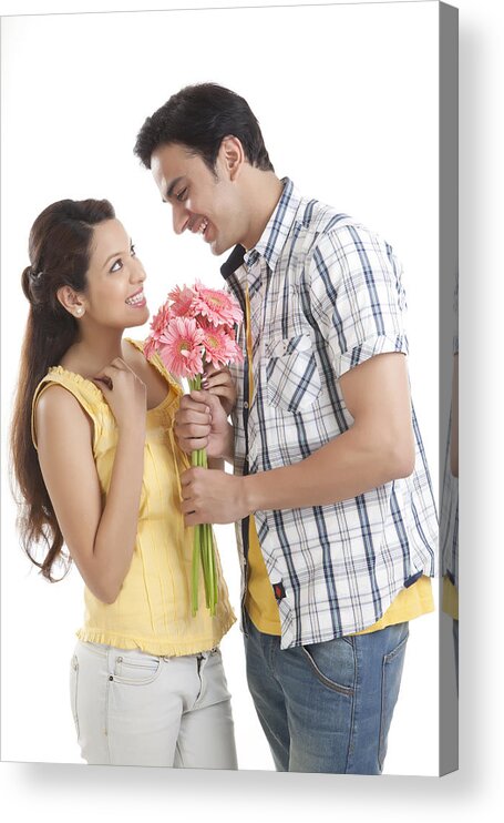 Young Men Acrylic Print featuring the photograph Man giving flowers to woman by Ravi Ranjan