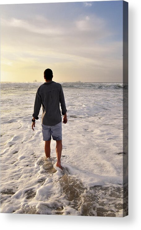 Man Acrylic Print featuring the photograph Man walking into the ocean at sunset stock photo by Mark Stout