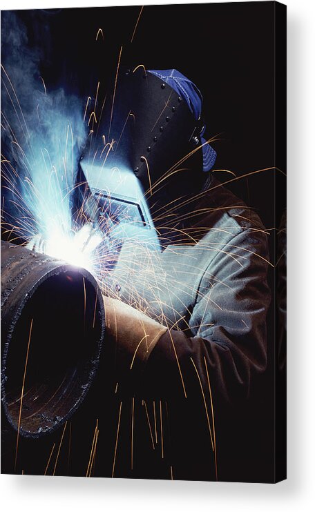One Man Only Acrylic Print featuring the photograph Welder Working on a Metallic Cylinder by Digital Vision.