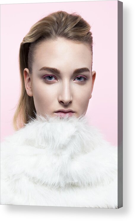 Cool Attitude Acrylic Print featuring the photograph Young woman with fake fur around her neck. by Andreas Kuehn