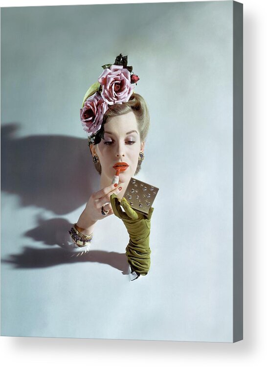 Accessories Acrylic Print featuring the photograph A Model Applying Lipstick by John Rawlings