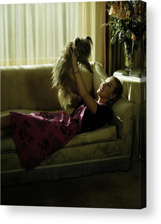Model Acrylic Print featuring the photograph A Model Holding A Dog by Constantin Joffe