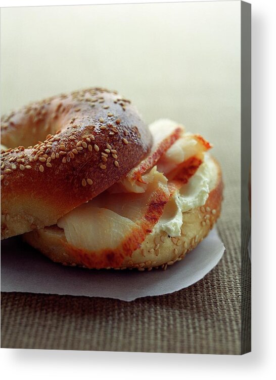 Still Life Acrylic Print featuring the photograph A Sesame Bagel by Romulo Yanes