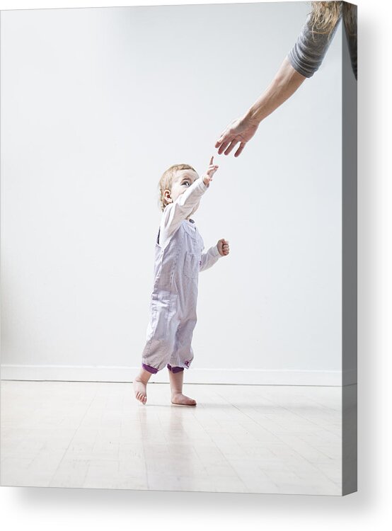 Toddler Acrylic Print featuring the photograph Todler learning to walk by David Trood