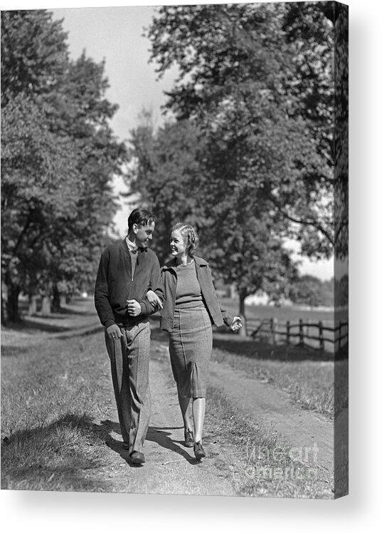 1930s Acrylic Print featuring the photograph Teen Couple Out For A Walk, C.1930-40s by H. Armstrong Roberts/ClassicStock