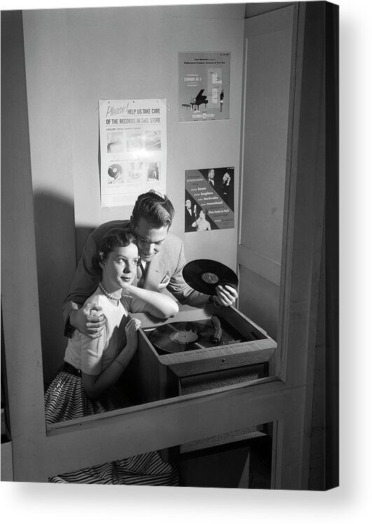 Photography Acrylic Print featuring the photograph 1950s Couple Sitting In Store Record by Vintage Images