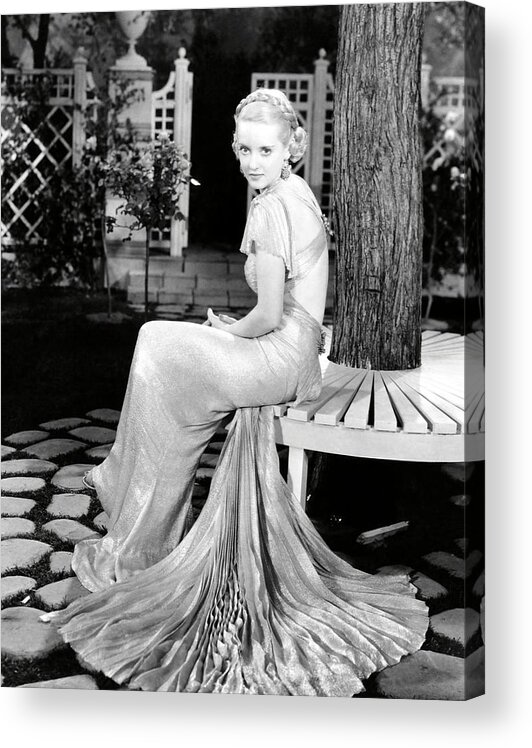 Bette Davis Acrylic Print featuring the photograph BETTE DAVIS in FASHIONS OF 1934 -1934-. by Album