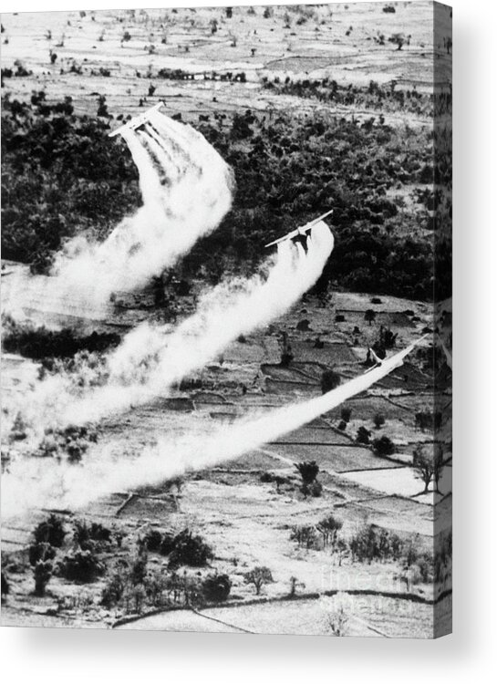 Vietnam War Acrylic Print featuring the photograph Jets Spraying Herbicides In Cambodia by Bettmann