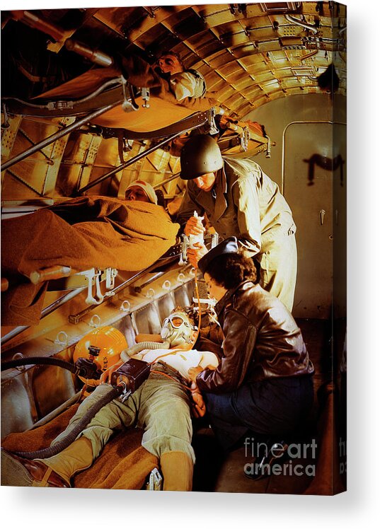 Working Acrylic Print featuring the photograph Military Nurse Helping The Wounded by Bettmann