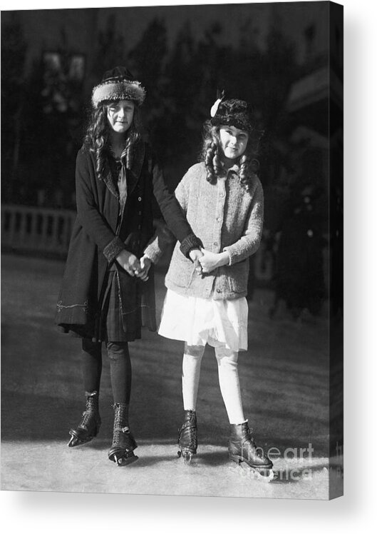 Child Acrylic Print featuring the photograph Two Young Girls Ice Skating by Bettmann