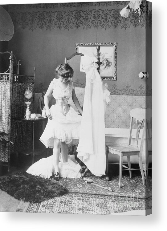 People Acrylic Print featuring the photograph Victorian Woman Undressing In The Bath by Bettmann