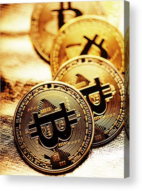 Bitcoin Acrylic Print featuring the photograph Closeup of golden bitcoin over gold background by Jelena Jovanovic